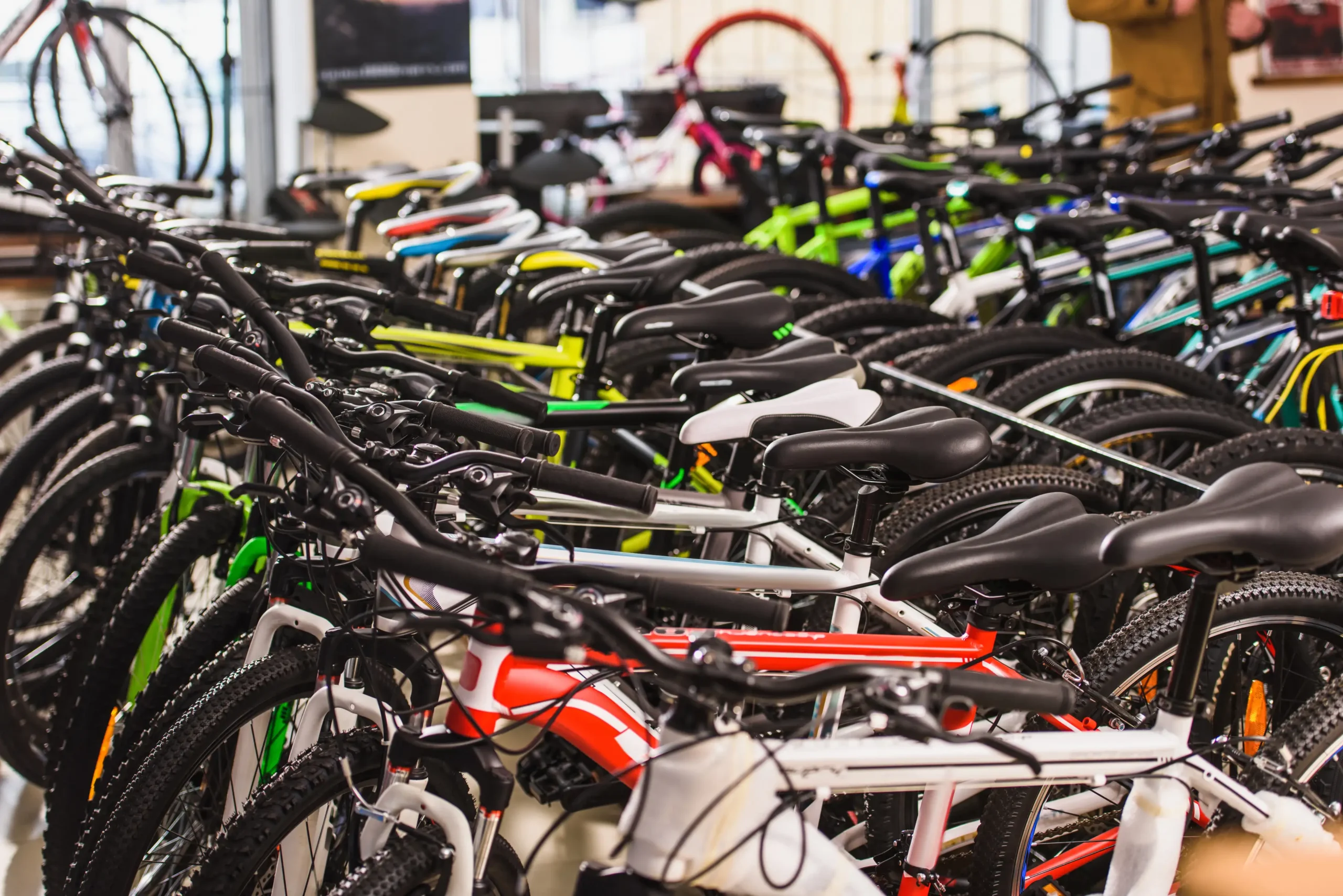 Various types of bikes displayed for bike sales at a retail store.